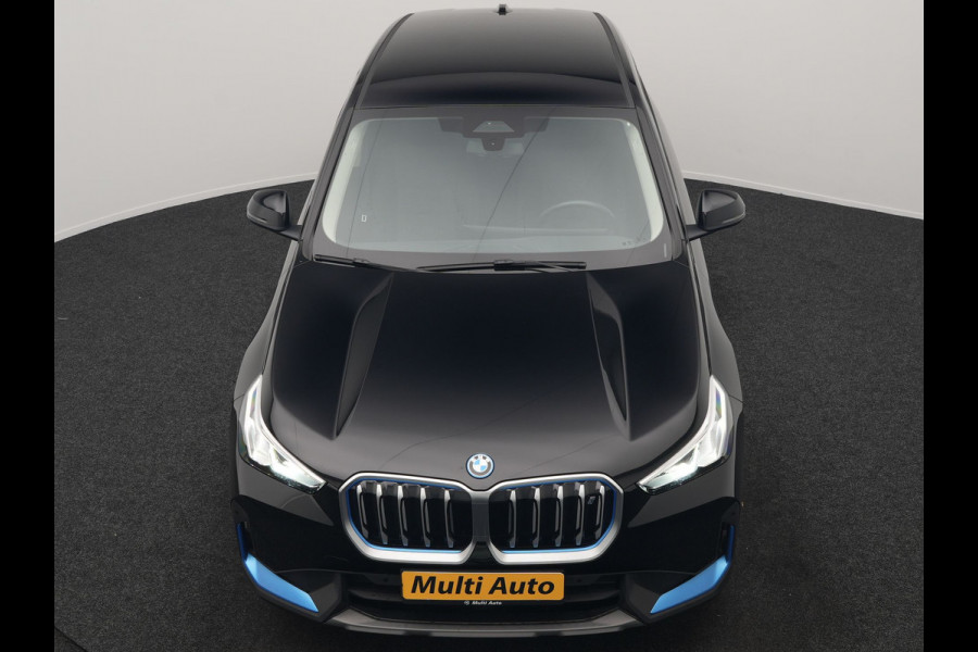 BMW iX1 xDrive30 67 kWh 313pk Dealer O.H. | Adaptief M Onderstel | Camera | Cruise Control | Stoelverwarming | Widescreen Navi | Park Assist | Apple Carplay | Navigatie | DAB | Standkachel |