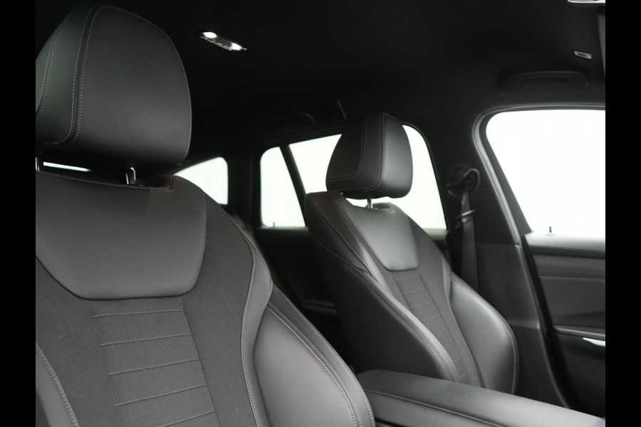 BMW 3 Serie Touring 330e Sportline PHEV 293pk Dealer O.H. | Dravitgrau | Trekhaak Af Fabriek | Adaptive Cruise | Laser LED | Head Up | Adaptief Onderstel | Camera | Sportstoelen Verwarmd | Sfeerverlichting | Keyless | Blis | Apple Carplay | 19"L.M | Plug In Hybrid |