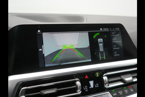 BMW 3 Serie Touring 330e Sportline PHEV 293pk Dealer O.H. | Dravitgrau | Trekhaak Af Fabriek | Adaptive Cruise | Laser LED | Head Up | Adaptief Onderstel | Camera | Sportstoelen Verwarmd | Sfeerverlichting | Keyless | Blis | Apple Carplay | 19"L.M | Plug In Hybrid |