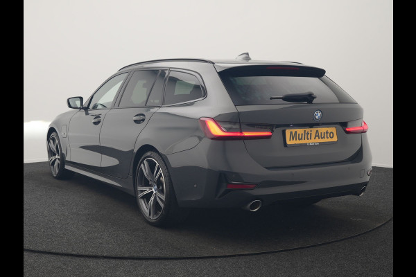 BMW 3 Serie Touring 330e Sportline PHEV 293pk Dealer O.H. | Dravitgrau | Trekhaak Af Fabriek | Adaptive Cruise | Laser LED | Head Up | Adaptief Onderstel | Camera | Sportstoelen Verwarmd | Sfeerverlichting | Keyless | Blis | Apple Carplay | 19"L.M | Plug In Hybrid |