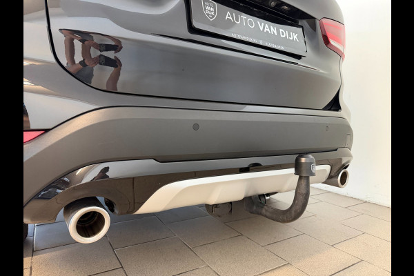 BMW X1 SDrive20i High Executive AIRCO CLIMA NAVI CRUISE PANO LEER STOELVERW HEAD UP TREKHAAK 1800KG CAMERA ELEK KLEP NIEUWSTAAT