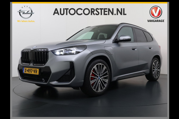 BMW X1 xDrive30e 327pk M-sport Leer Pano-Dak/Hef-Dak M-Sportstoelen+Elektr.+Geheugen+Verwarmd Trekhaak Harman-Kardon Adaptive-LED Live- Adaptive-Cruise AWD StuurVerwarmd Zwarte-Hemel Travelpack Park-Assist Pdc Draadloze lader Innovations-pakket Comfort-Pack €75.000,- Nieuw  Orig.NL auto! 1.800kg trekvermogen
