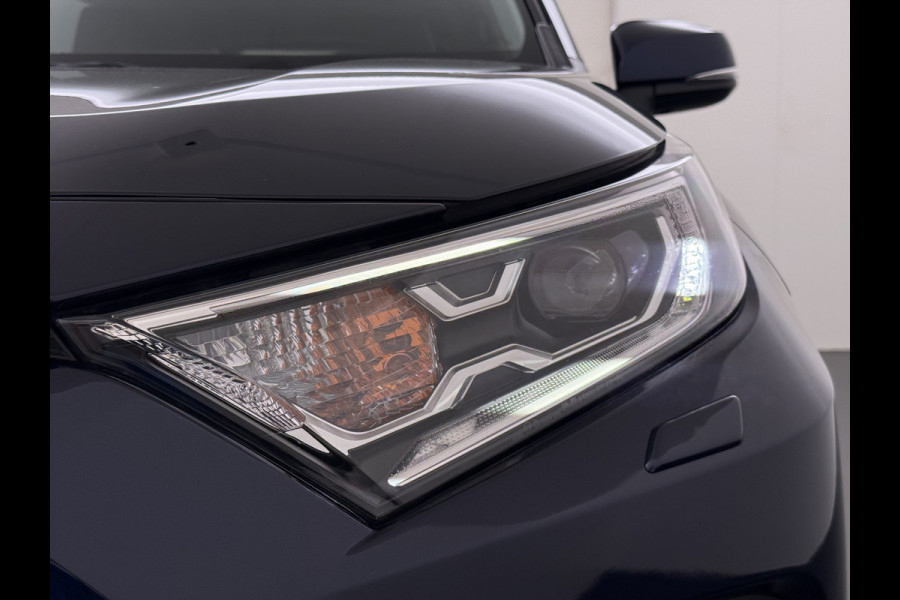 Toyota RAV4 2.5I Hybrid Leder+Verwarming+Memory Adap.Cruise Navi Camera Ecc Apple Carplay Android Auto Miracast™ Elek.Achterklep Active Stuur+Voorruit+Achterbankverwarming Keyless Lane Assist Privacy Glas Lmv Elek.Stoel Bluetooth Led