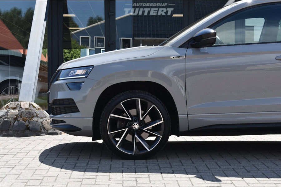 Škoda Karoq 1.5 TSI ACT Sportline | TREKHAAK | STEEL GREY | ADAPTIEVE CRUISE CONTROLE | CAMERA | NAP | STOELVERWARMING | CANTON
