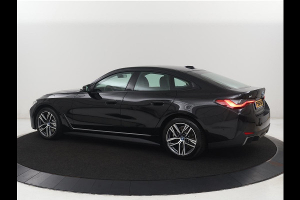 BMW i4 eDrive40 84 kWh | SOH 93,8% | Camera | Adaptive cruise | Climate control | Navigatie | DAB+ | Bluetooth | Stoelverwarming | Carplay