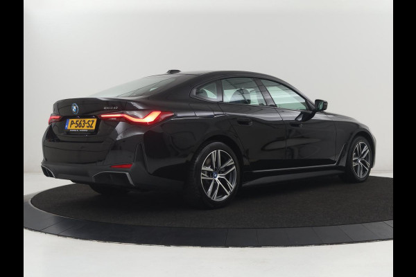 BMW i4 eDrive40 84 kWh | SOH 93,8% | Camera | Adaptive cruise | Climate control | Navigatie | DAB+ | Bluetooth | Stoelverwarming | Carplay