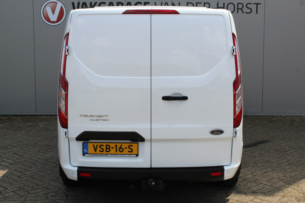 Ford Transit Custom 300 2.0-108pk TDCI L2H1 Trend. Erg nette Ford Transit Custom, die u nog jaren van dienst kan zijn ! Airco, voorraamverw., trekhaak, cruise control, camera, parkeersensoren v+a, 3-zits, laadruimte betimmerd etc.