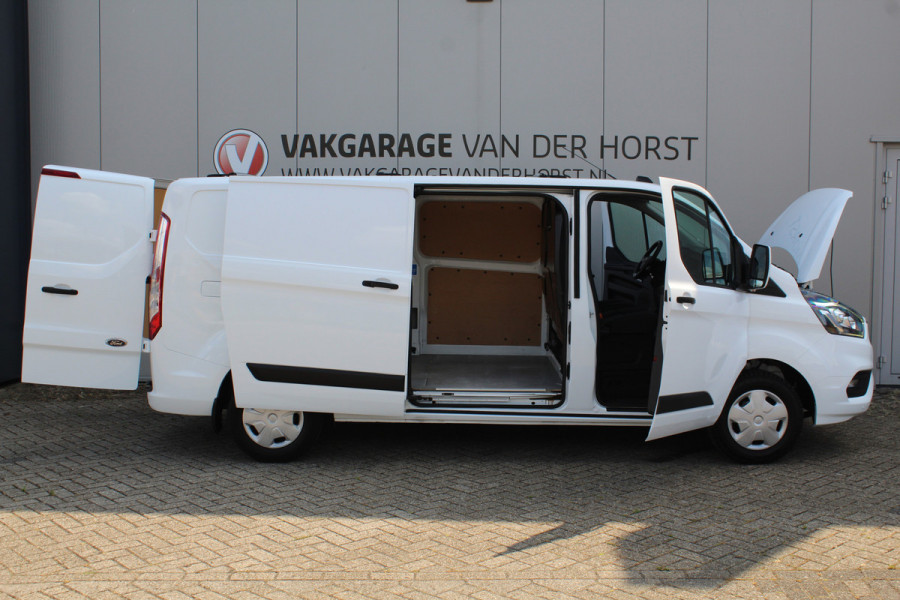 Ford Transit Custom 300 2.0-108pk TDCI L2H1 Trend. Erg nette Ford Transit Custom, die u nog jaren van dienst kan zijn ! Airco, voorraamverw., trekhaak, cruise control, camera, parkeersensoren v+a, 3-zits, laadruimte betimmerd etc.