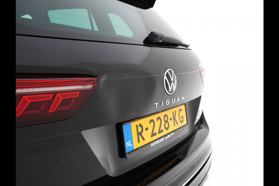 Volkswagen Tiguan 1.4 TSI eHybrid R-Line Business+ (Plug-in) (INCL-BTW) Aut. *LEATHER-FABRIC | FULL-LED | ADAPTIVE-CRUISE | CAMERA | DIGI-COCKPIT | KEYLESS | PRIVACY-GLASS | SPORTSEATS | SHIFTPADDLES | NAVI-FULLMAP | ECC | PDC | 19''ALU*