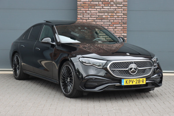Mercedes-Benz E-Klasse 400 e 4MATIC AMG Line | Luchtvering | Achterasbesturing | Hyperscreen | Distronic+ | Trekhaak | Digital Light | HUD | Burmester | Achterbank Verwarmd |3D-Display |
