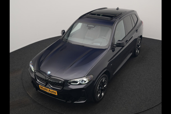 BMW iX3 M Sport High Executive 80 kWh 286pk Dealer O.H. SOH 95% | Trekhaak Af Fabriek | Panodak | Head Up | 360 Camera | Harman / Kardon | Lederen Sportstoelen Memory & Verwarmd | Keyless | Blis | Sfeerverlichting | 20"L.M | Adaptive LED |