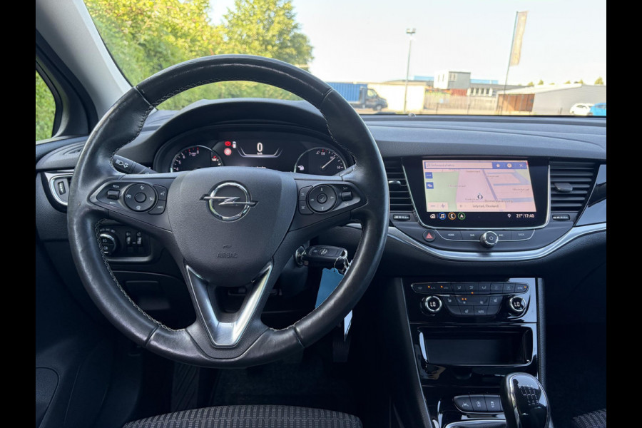 Opel Astra 1.2 Launch Elegance 2e Eigenaar,Camera,Stoelverw-Stuurverw,110pk,Navi,Carplay,Halfleder,Elekt.Stoel,6 Bak,Clima,Cruise,Lm velgen,Pdc V+A,N.A.P,Net beurt gehad,Apk tot 09-2028