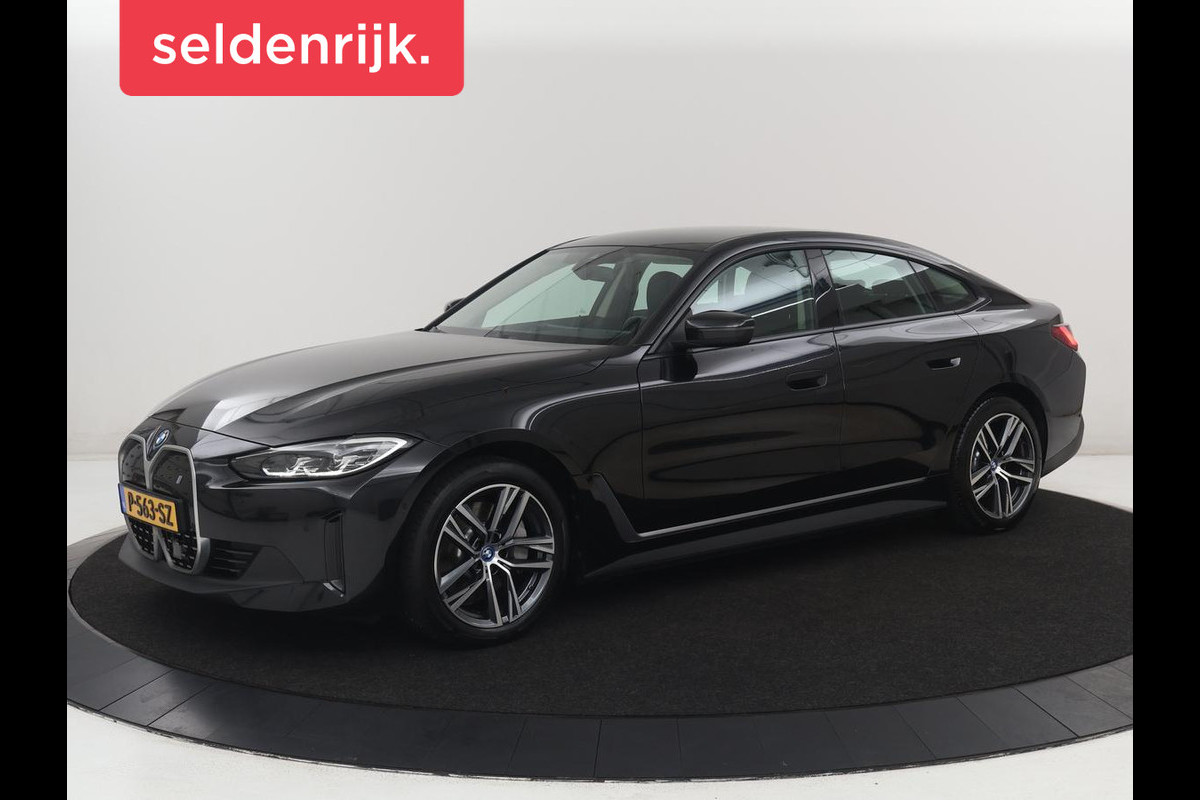 BMW i4 eDrive40 84 kWh | SOH 93,8% | Camera | Adaptive cruise | Climate control | Navigatie | DAB+ | Bluetooth | Stoelverwarming | Carplay