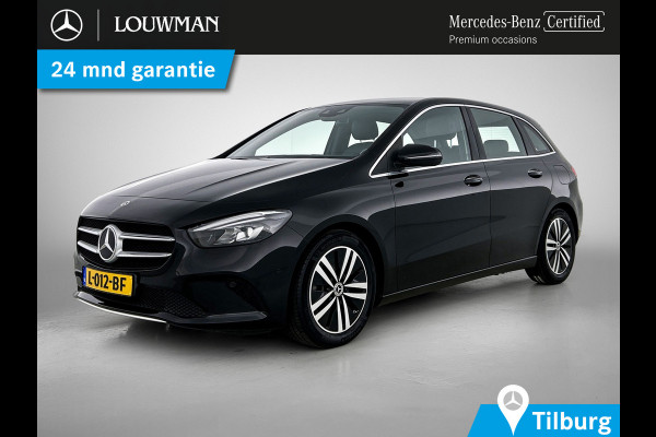 Mercedes-Benz B-Klasse 180 Business Solution Luxury Trekhaak | Parkeerpakket met achteruitrijcamera | Ledkoplampen | Sfeerverlichting | Stoelverwarming. Inclusief 24 maanden MB Certified garantie voor Europa.