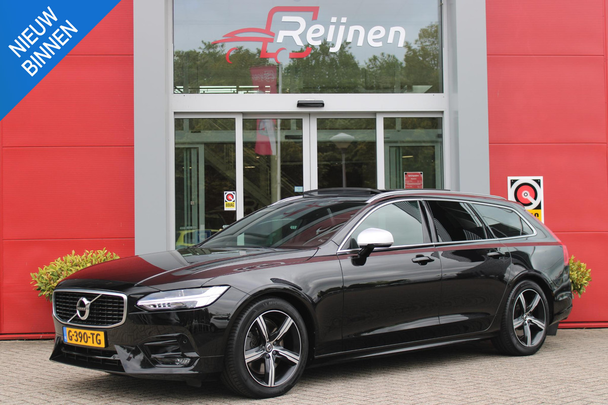 Volvo V90 2.0 T4 190PK R-Design | PANORAMISCH SCHUIF/KANTEL DAK | HARMAN KARDON PREMIUM AUDIO | ELEKTRSICHE VOORSTOELEN MET GEHEUGEN FUNCTIE | STOEL/STUUR VERWARMING | ACHTERBANK VERWARMING | HEAD-UP DISPLAY | MISTLAMPEN VOOR | KEYLESS ENTRY / START | APPLE CARPLAY | ADROID AUTO | ELEKTRISCH BEDIENBARE ACHTERKLEP | ACHTERUITRIJCAMERA | STANDKACHEL |