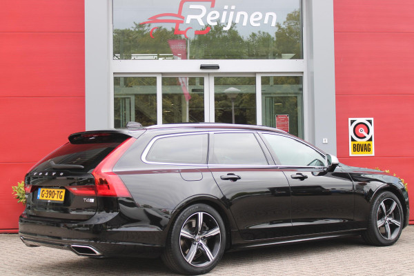 Volvo V90 2.0 T4 190PK R-Design | PANORAMISCH SCHUIF/KANTEL DAK | HARMAN KARDON PREMIUM AUDIO | ELEKTRSICHE VOORSTOELEN MET GEHEUGEN FUNCTIE | STOEL/STUUR VERWARMING | ACHTERBANK VERWARMING | HEAD-UP DISPLAY | MISTLAMPEN VOOR | KEYLESS ENTRY / START | APPLE CARPLAY | ADROID AUTO | ELEKTRISCH BEDIENBARE ACHTERKLEP | ACHTERUITRIJCAMERA | STANDKACHEL |