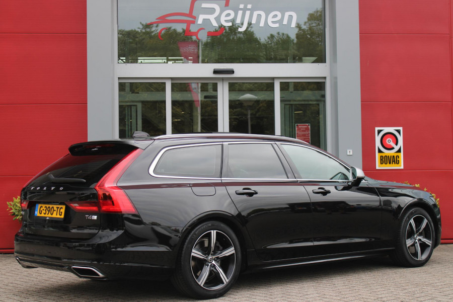 Volvo V90 2.0 T4 190PK R-Design | PANORAMISCH SCHUIF/KANTEL DAK | HARMAN KARDON PREMIUM AUDIO | ELEKTRSICHE VOORSTOELEN MET GEHEUGEN FUNCTIE | STOEL/STUUR VERWARMING | ACHTERBANK VERWARMING | HEAD-UP DISPLAY | MISTLAMPEN VOOR | KEYLESS ENTRY / START | APPLE CARPLAY | ADROID AUTO | ELEKTRISCH BEDIENBARE ACHTERKLEP | ACHTERUITRIJCAMERA | STANDKACHEL |