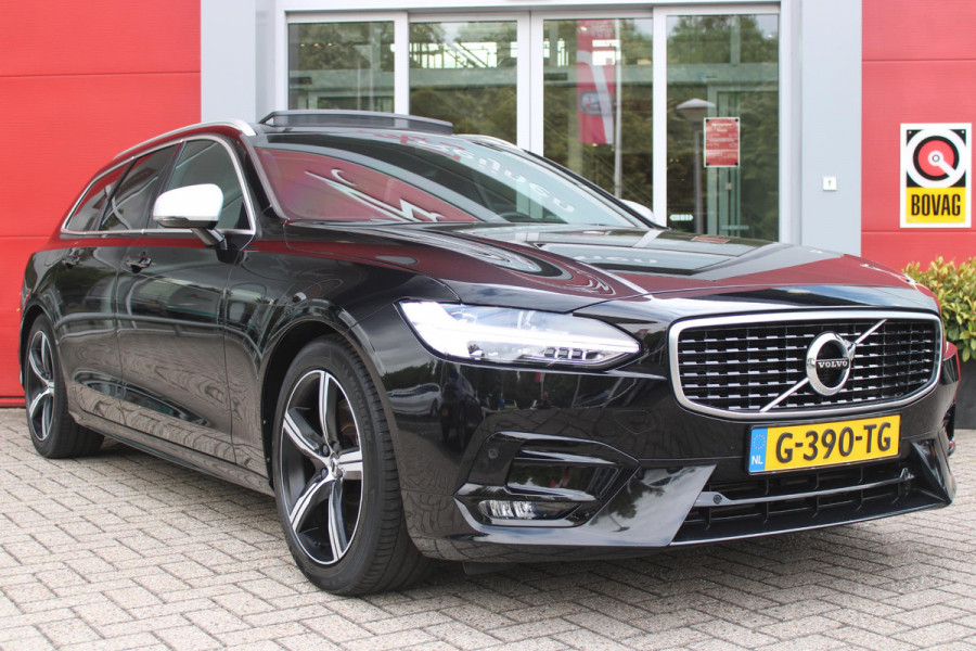 Volvo V90 2.0 T4 190PK R-Design | PANORAMISCH SCHUIF/KANTEL DAK | HARMAN KARDON PREMIUM AUDIO | ELEKTRSICHE VOORSTOELEN MET GEHEUGEN FUNCTIE | STOEL/STUUR VERWARMING | ACHTERBANK VERWARMING | HEAD-UP DISPLAY | MISTLAMPEN VOOR | KEYLESS ENTRY / START | APPLE CARPLAY | ADROID AUTO | ELEKTRISCH BEDIENBARE ACHTERKLEP | ACHTERUITRIJCAMERA | STANDKACHEL |