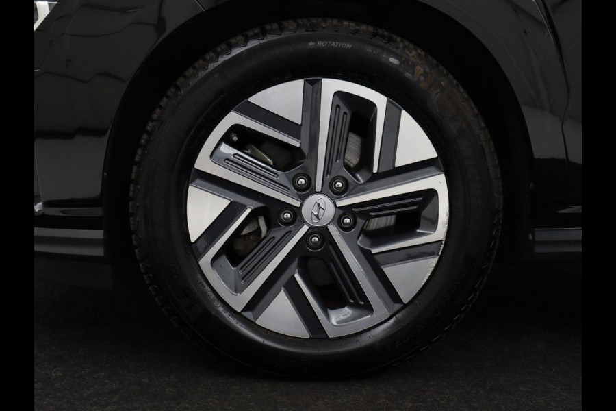 Hyundai Kona EV Premium 64 KWh | SOH 96.2% | Leder | Trekhaak | Head-up | Stoelventilatie | Stuur/stoel verwarming | Adaptive cruise | Camera | Park assist | Carplay | Dodehoek detectie | Krell sound |