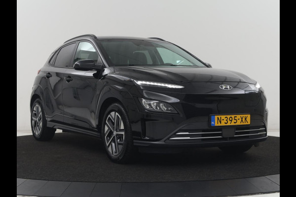 Hyundai Kona EV Premium 64 KWh | SOH 96.2% | Leder | Trekhaak | Head-up | Stoelventilatie | Stuur/stoel verwarming | Adaptive cruise | Camera | Park assist | Carplay | Dodehoek detectie | Krell sound |