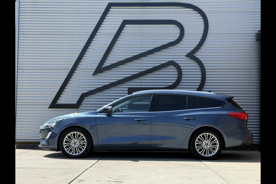 Ford FOCUS Wagon 1.0 EcoBoost Titanium Business 2e Eigenaar|Pano|Stoel+stuurverw|Adap Cruise|Carplay|HUD|Dealer Onderhouden|Camera|Clima|PDC V+A|Trekhaak|LM velgen|Navi|Elek Ramen|N.A.P.|APK tot 07-2027