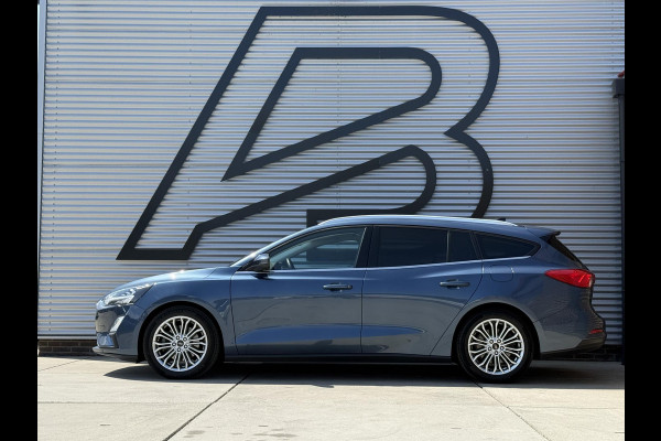 Ford FOCUS Wagon 1.0 EcoBoost Titanium Business 2e Eigenaar|Pano|Stoel+stuurverw|Adap Cruise|Carplay|HUD|Dealer Onderhouden|Camera|Clima|PDC V+A|Trekhaak|LM velgen|Navi|Elek Ramen|N.A.P.|APK tot 07-2027