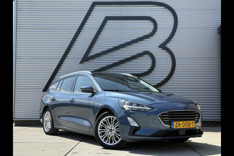 Ford FOCUS Wagon 1.0 EcoBoost Titanium Business 2e Eigenaar|Pano|Stoel+stuurverw|Adap Cruise|Carplay|HUD|Dealer Onderhouden|Camera|Clima|PDC V+A|Trekhaak|LM velgen|Navi|Elek Ramen|N.A.P.|APK tot 07-2027