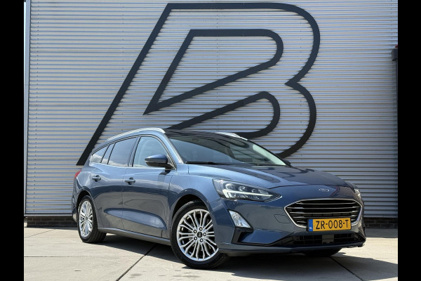 Ford FOCUS Wagon 1.0 EcoBoost Titanium Business 2e Eigenaar|Pano|Stoel+stuurverw|Adap Cruise|Carplay|HUD|Dealer Onderhouden|Camera|Clima|PDC V+A|Trekhaak|LM velgen|Navi|Elek Ramen|N.A.P.|APK tot 07-2027