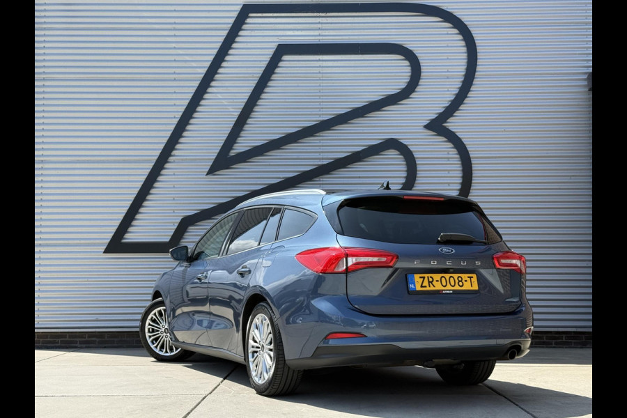 Ford FOCUS Wagon 1.0 EcoBoost Titanium Business 2e Eigenaar|Pano|Stoel+stuurverw|Adap Cruise|Carplay|HUD|Dealer Onderhouden|Camera|Clima|PDC V+A|Trekhaak|LM velgen|Navi|Elek Ramen|N.A.P.|APK tot 07-2027