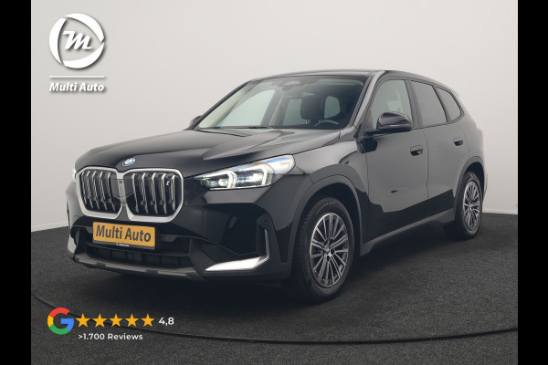 BMW iX1 xDrive30 67 kWh 313pk Dealer O.H. | Trekhaak Af Fabriek | Camera | Adaptief M Onderstel | Voorstoelen Verwarmd | Keyless | Sfeerverlichting | Apple Carplay | Adaptive LED | Cruise Control | Navigatie | DAB |