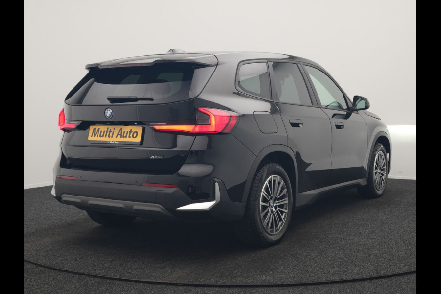 BMW iX1 xDrive30 67 kWh 313pk Dealer O.H. | Trekhaak Af Fabriek | Camera | Adaptief M Onderstel | Voorstoelen Verwarmd | Keyless | Sfeerverlichting | Apple Carplay | Adaptive LED | Cruise Control | Navigatie | DAB |