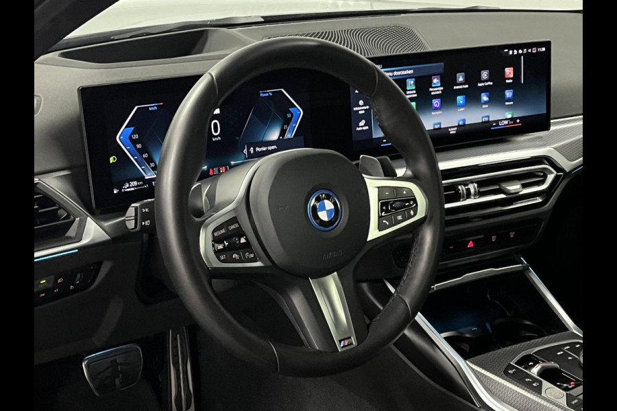 BMW 3-serie 330e M Sport | Open dak | Adapt. cruise | Trekhaak | Head-up | Stoelverwarming | Sfeerverlichting | Carplay | Leder