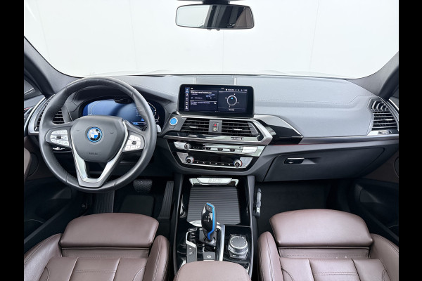 BMW iX3 High Executive 80kWh SOH 96% Panoramadak Sportstoelen Adap.Cruise Harman&Kardon® 360°Camera Head-Up Display Wireless Appel Carpl Elek.Stoelen Memory Stoelverwarming Elek.Achterklep Lmv 20" Privacy Glas DAB Adap.Led Keyless 1e Eigenaar Dealeronderhouden Origineel Nederlandse BMW