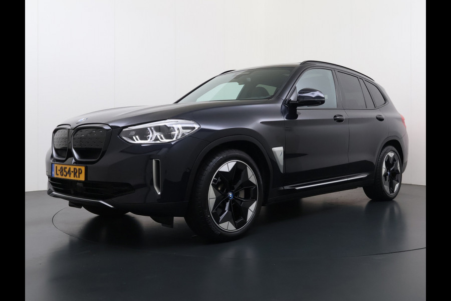 BMW iX3 High Executive 80kWh SOH 96% Panoramadak Sportstoelen Adap.Cruise Harman&Kardon® 360°Camera Head-Up Display Wireless Appel Carpl Elek.Stoelen Memory Stoelverwarming Elek.Achterklep Lmv 20" Privacy Glas DAB Adap.Led Keyless 1e Eigenaar Dealeronderhouden Origineel Nederlandse BMW