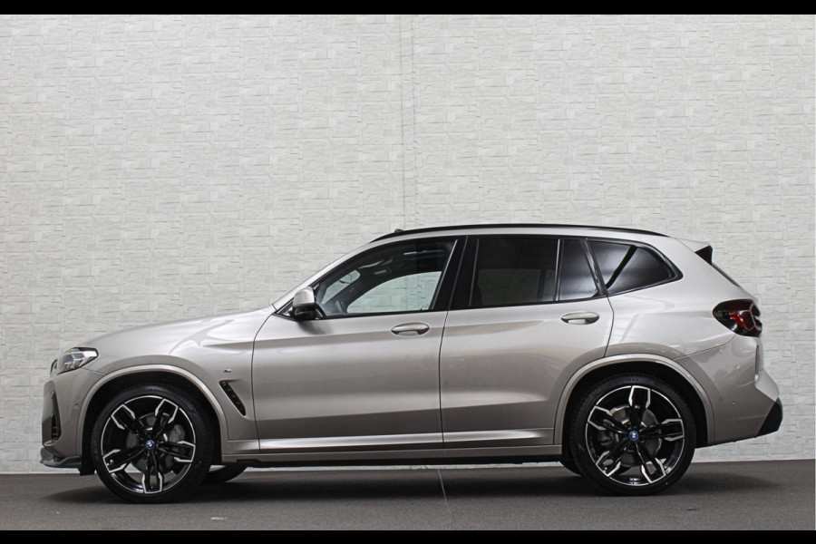 BMW iX3 M-Sport 80 kWh | Panorama | 360 Camera | ACC | Leder | 99% SOH | Head-Up | Keyless-Entry | Harman-Kardon | Memory | Dodehoek | 3-Zone Clima | Sfeerverlichting | Carplay | ISO-Glas | Draadloos Laden | Bovag Garantie |