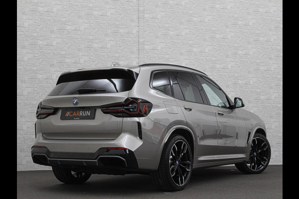 BMW iX3 M-Sport 80 kWh | Panorama | 360 Camera | ACC | Leder | 99% SOH | Head-Up | Keyless-Entry | Harman-Kardon | Memory | Dodehoek | 3-Zone Clima | Sfeerverlichting | Carplay | ISO-Glas | Draadloos Laden | Bovag Garantie |