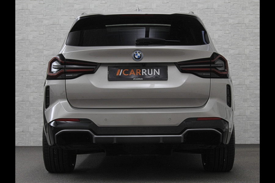 BMW iX3 M-Sport 80 kWh | Panorama | 360 Camera | ACC | Leder | 99% SOH | Head-Up | Keyless-Entry | Harman-Kardon | Memory | Dodehoek | 3-Zone Clima | Sfeerverlichting | Carplay | ISO-Glas | Draadloos Laden | Bovag Garantie |