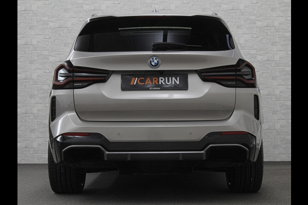 BMW iX3 M-Sport 80 kWh | Panorama | 360 Camera | ACC | Leder | 99% SOH | Head-Up | Keyless-Entry | Harman-Kardon | Memory | Dodehoek | 3-Zone Clima | Sfeerverlichting | Carplay | ISO-Glas | Draadloos Laden | Bovag Garantie |