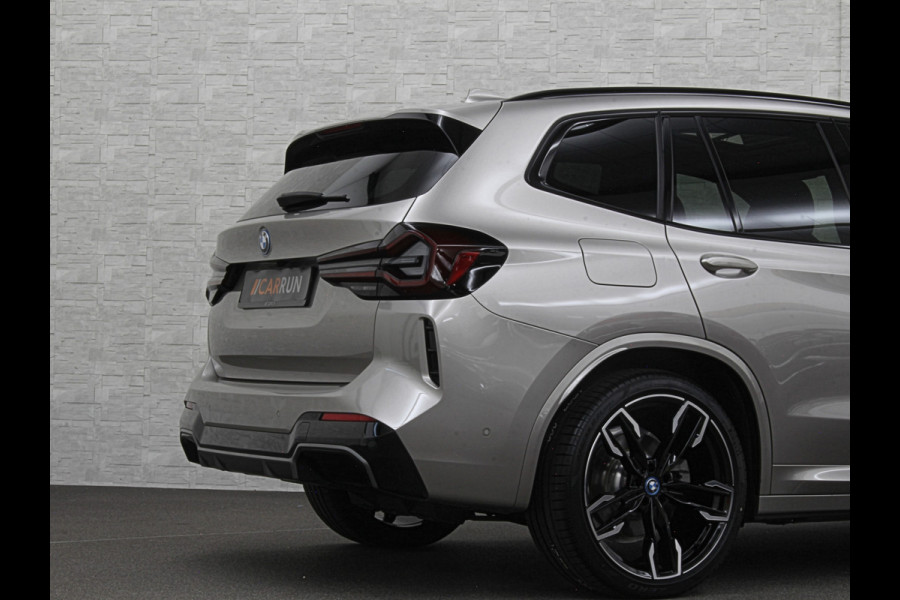 BMW iX3 M-Sport 80 kWh | Panorama | 360 Camera | ACC | Leder | 99% SOH | Head-Up | Keyless-Entry | Harman-Kardon | Memory | Dodehoek | 3-Zone Clima | Sfeerverlichting | Carplay | ISO-Glas | Draadloos Laden | Bovag Garantie |