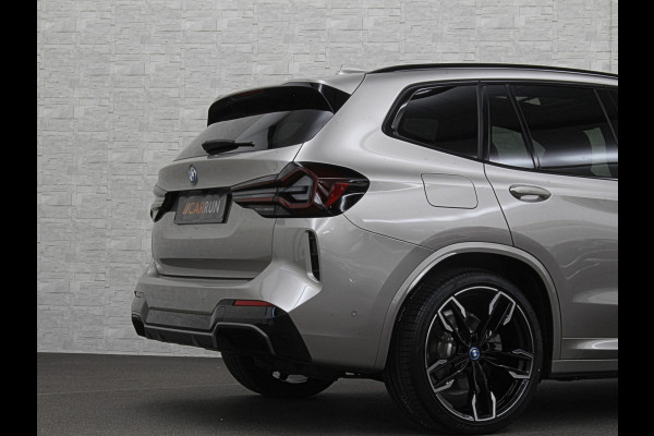 BMW iX3 M-Sport 80 kWh | Panorama | 360 Camera | ACC | Leder | 99% SOH | Head-Up | Keyless-Entry | Harman-Kardon | Memory | Dodehoek | 3-Zone Clima | Sfeerverlichting | Carplay | ISO-Glas | Draadloos Laden | Bovag Garantie |