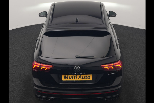Volkswagen Tiguan 1.4 TSI eHybrid R-Line Business PHEV 245pk | Trekhaak Af Fabriek | Adaptive Cruise | IQ Light | Camera | Lederen Sportstoelen Memory & Verwarmd | Sfeerverlichting | Stuur Verwarmd | Apple Carplay | Navigatie | DAB | 20"L.M | Plug In Hybrid |