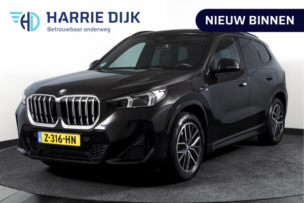 BMW X1 sDrive18i 136 PK | M-Sport | Afn. Trekhaak | Dig. Cockpit | Cruise | PDC | Camera | NAV + App. Connect | ECC | Elek. Klep | LM 18" |