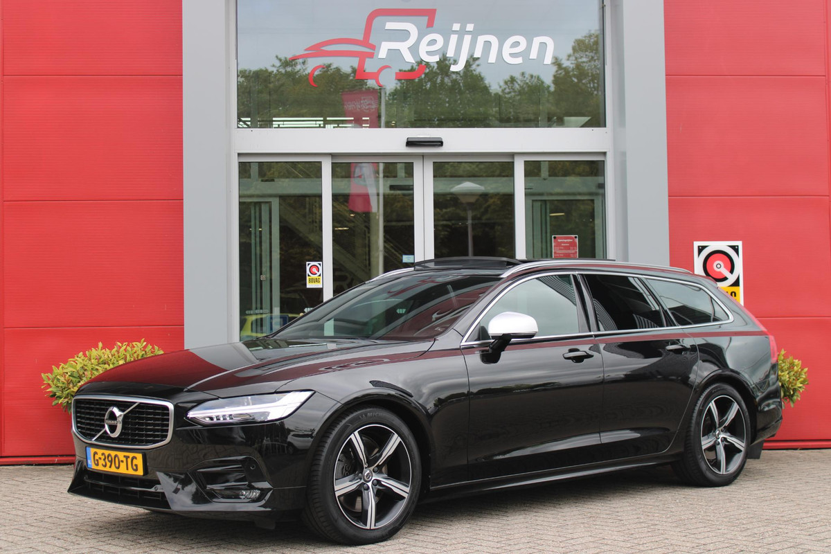 Volvo V90 2.0 T4 190PK R-Design | PANORAMISCH SCHUIF/KANTEL DAK | HARMAN KARDON PREMIUM AUDIO | ELEKTRSICHE VOORSTOELEN MET GEHEUGEN FUNCTIE | STOEL/STUUR VERWARMING | ACHTERBANK VERWARMING | HEAD-UP DISPLAY | MISTLAMPEN VOOR | KEYLESS ENTRY / START | APPLE CARPLAY | ADROID AUTO | ELEKTRISCH BEDIENBARE ACHTERKLEP | ACHTERUITRIJCAMERA | STANDKACHEL |
