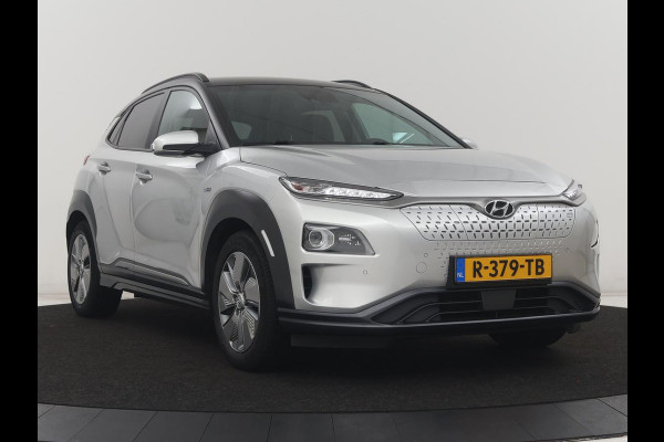 Hyundai Kona EV Fashion Design 64 kWh | SOH 94.6% | Leder | Head-up | Trekhaak | Adaptive cruise | Carplay | Stoelverwarming | Krell Sound | Dodehoek detectie |