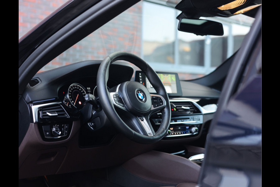 BMW 5 Serie Touring M550d xDrive | Pano - Trekhaak - HUD