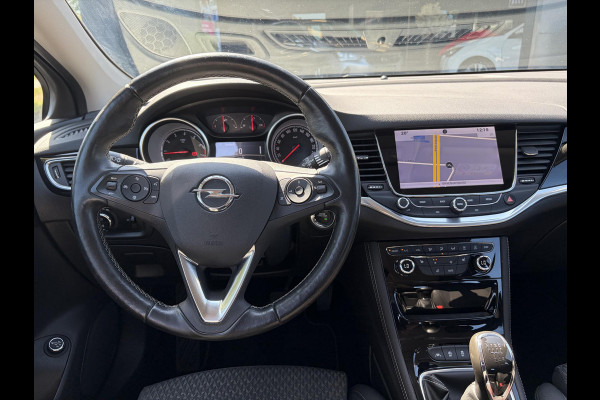 Opel Astra Sports Tourer 1.4 Business Executive 2e Eigenaar l 150pk l Carplay l Navi l Pdc V+A l Stoelvw-Stuurverw l Clima l Cruise l 18''Lmv l Halfleder l 6 Bak l Rijstrooksensor l N.A.P l Apk tot 08-2027