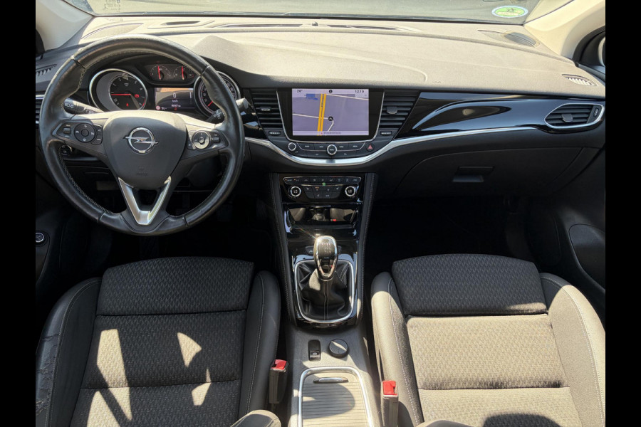 Opel Astra Sports Tourer 1.4 Business Executive 2e Eigenaar l 150pk l Carplay l Navi l Pdc V+A l Stoelvw-Stuurverw l Clima l Cruise l 18''Lmv l Halfleder l 6 Bak l Rijstrooksensor l N.A.P l Apk tot 08-2027