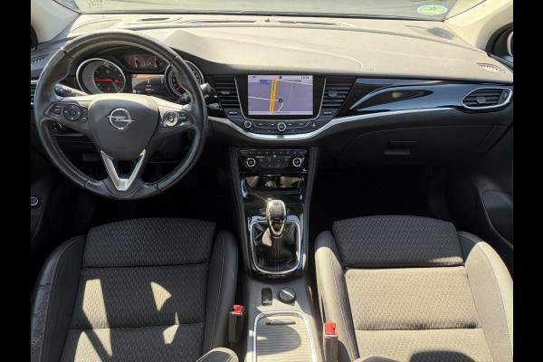 Opel Astra Sports Tourer 1.4 Business Executive 2e Eigenaar l 150pk l Carplay l Navi l Pdc V+A l Stoelvw-Stuurverw l Clima l Cruise l 18''Lmv l Halfleder l 6 Bak l Rijstrooksensor l N.A.P l Apk tot 08-2027
