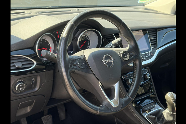 Opel Astra Sports Tourer 1.4 Business Executive 2e Eigenaar l 150pk l Carplay l Navi l Pdc V+A l Stoelvw-Stuurverw l Clima l Cruise l 18''Lmv l Halfleder l 6 Bak l Rijstrooksensor l N.A.P l Apk tot 08-2027