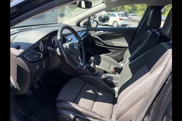 Opel Astra Sports Tourer 1.4 Business Executive 2e Eigenaar l 150pk l Carplay l Navi l Pdc V+A l Stoelvw-Stuurverw l Clima l Cruise l 18''Lmv l Halfleder l 6 Bak l Rijstrooksensor l N.A.P l Apk tot 08-2027